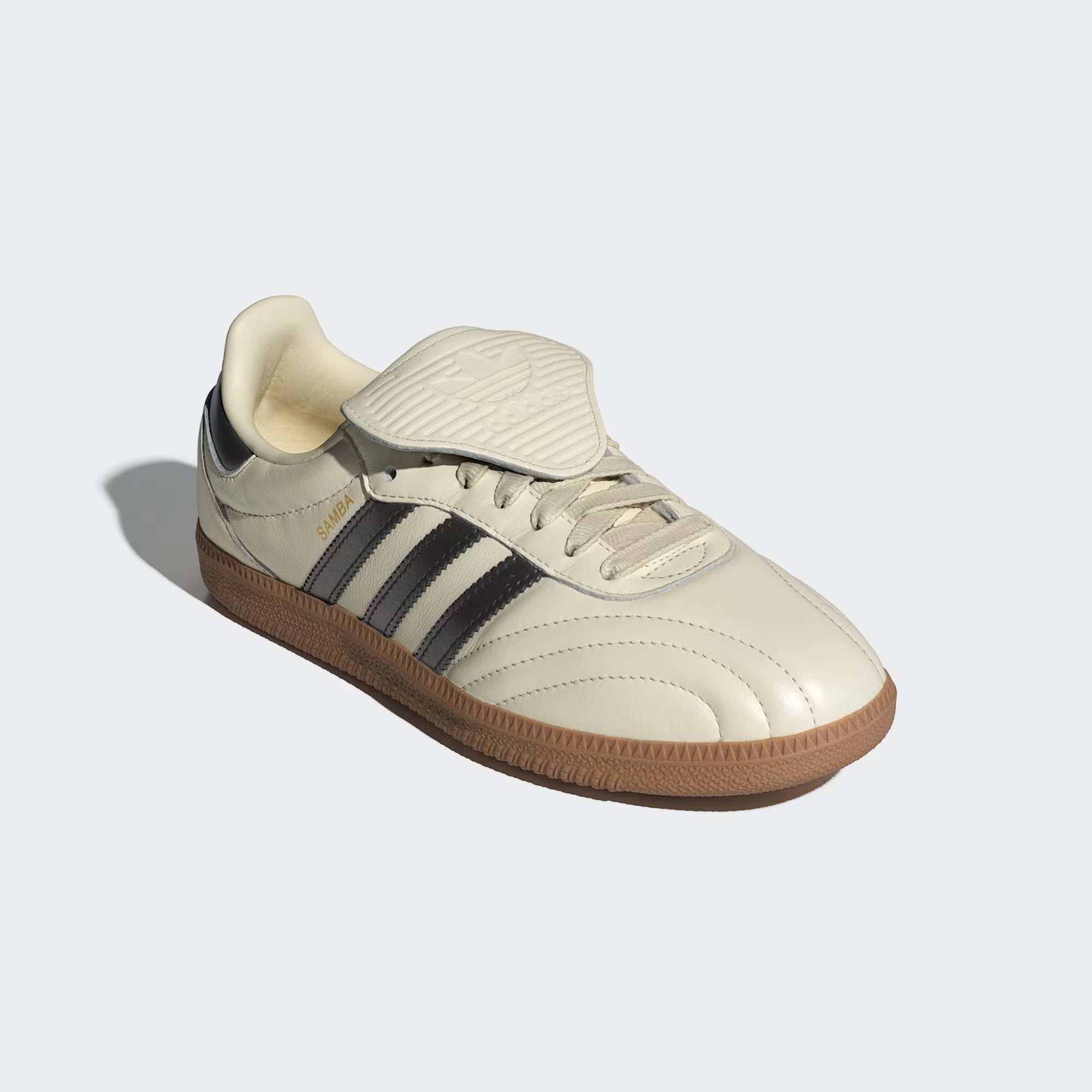 Top-down shot of the adidas Samba shoes showing the folded rubber tongue and embossed Trefoil logo.