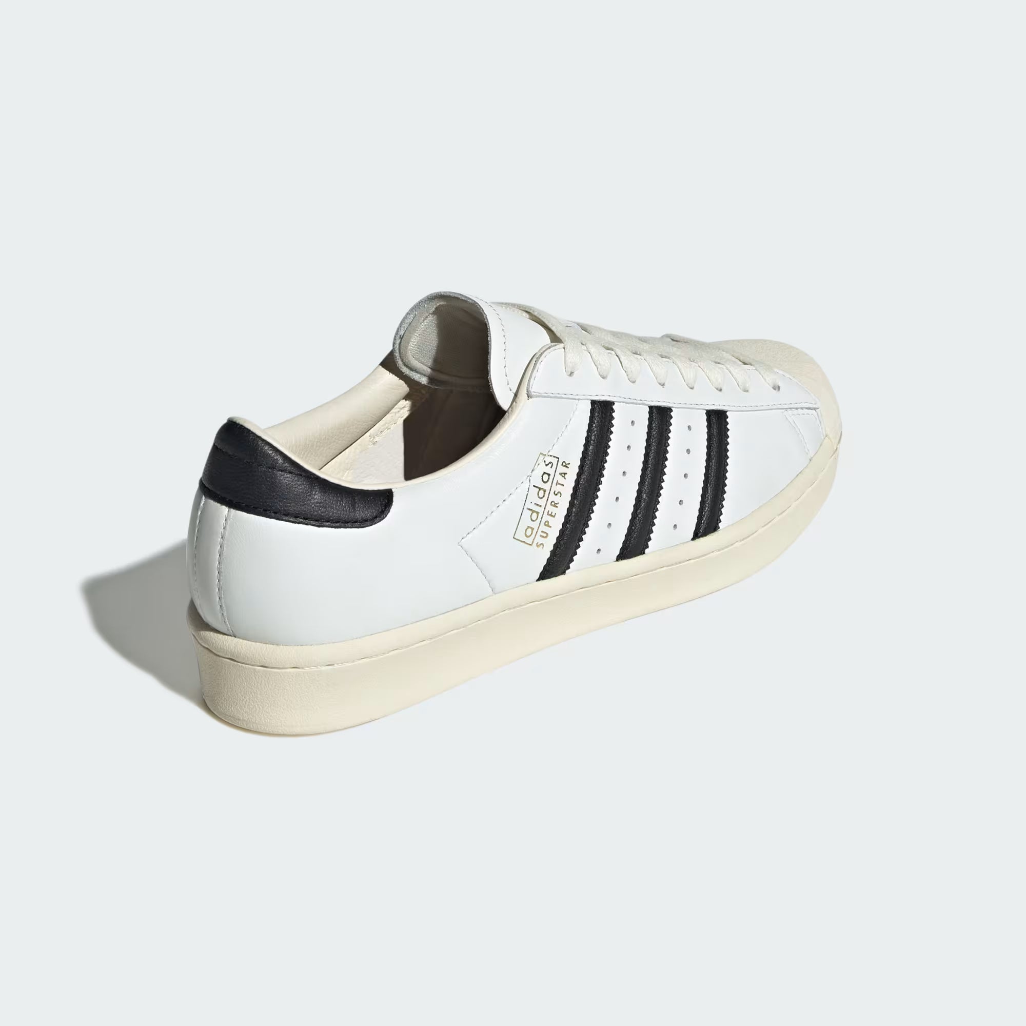 Close-up of the cream-colored rubber cupsole of Adidas Superstar Vintage Sneakers, emphasizing the vintage aesthetic.