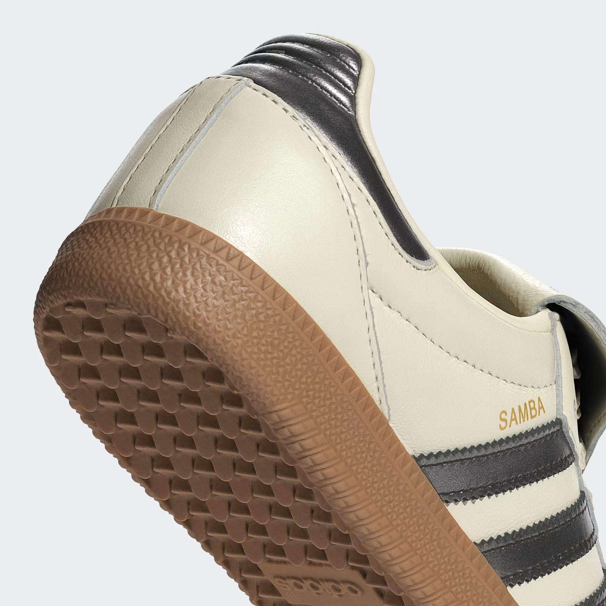 Top-down shot of the adidas Samba shoes showing the folded rubber tongue and embossed Trefoil logo.