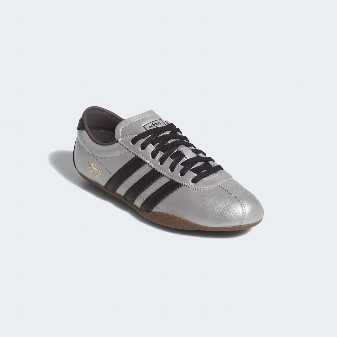 Adidas Womens Silver Metallic Sneakers styled with casual attire, perfect for a modern, fashionable look.