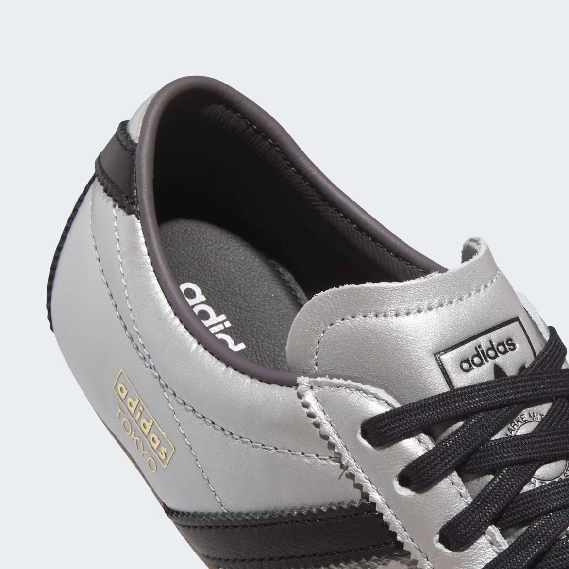 Adidas Womens Silver Metallic Sneakers styled with casual attire, perfect for a modern, fashionable look.