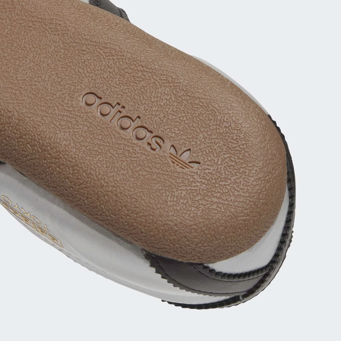 Close-up of the smooth leather lining inside the Adidas Womens Silver Metallic Sneakers.