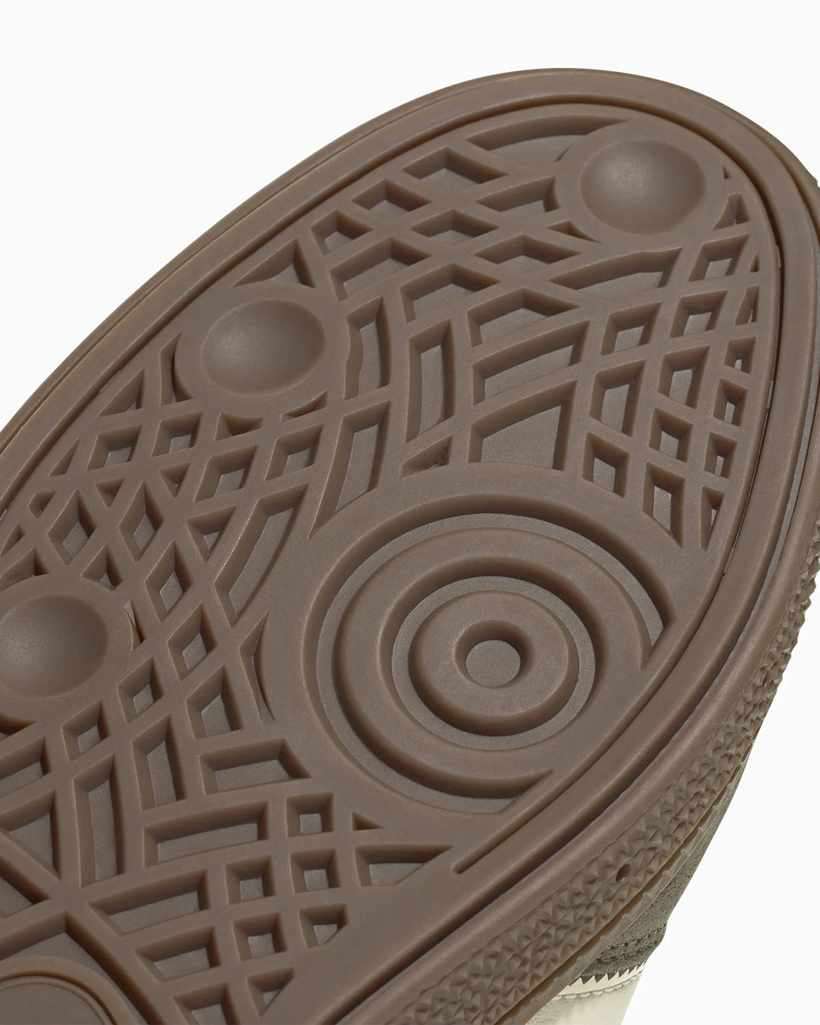 Close-up of the olive green handball sneakers showing the gold SPEZIAL detail and cream laces.