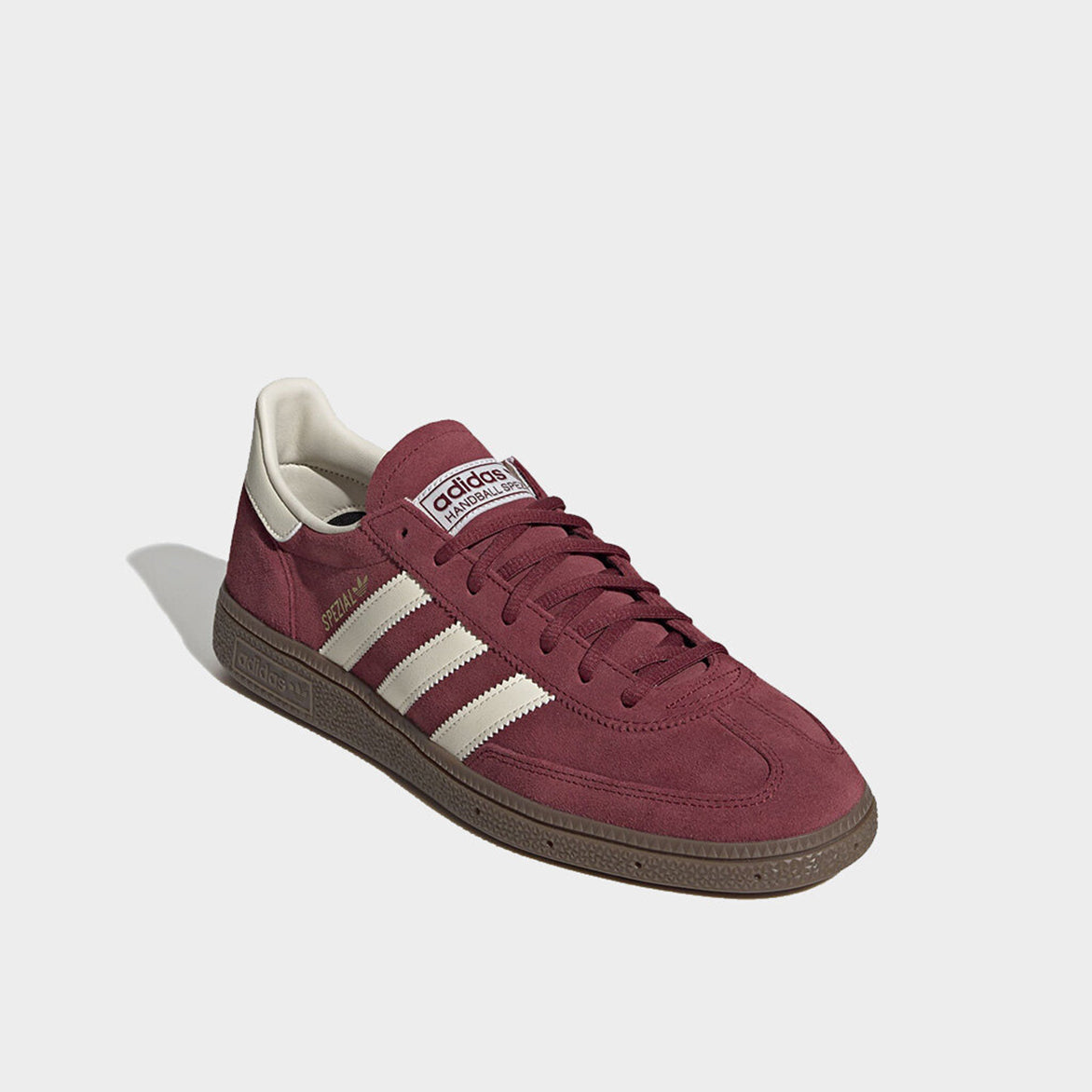 Side view of retro style adidas spezial sneakers in cream and maroon