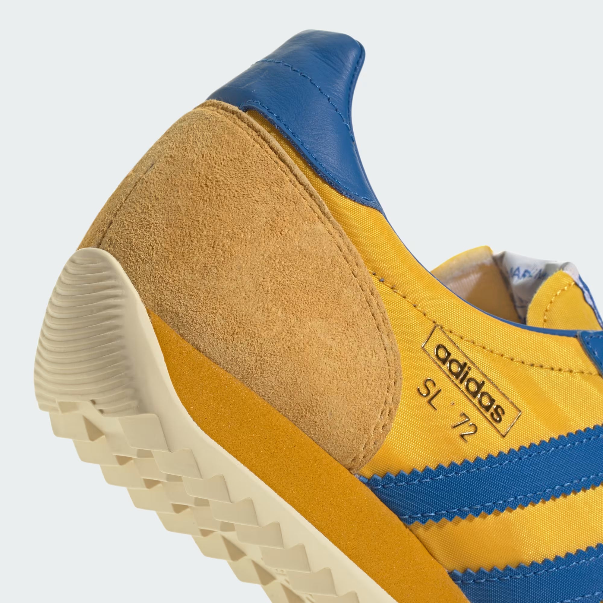 Lifestyle shot of adidas SL 72 PT shoes paired with streetwear outfit