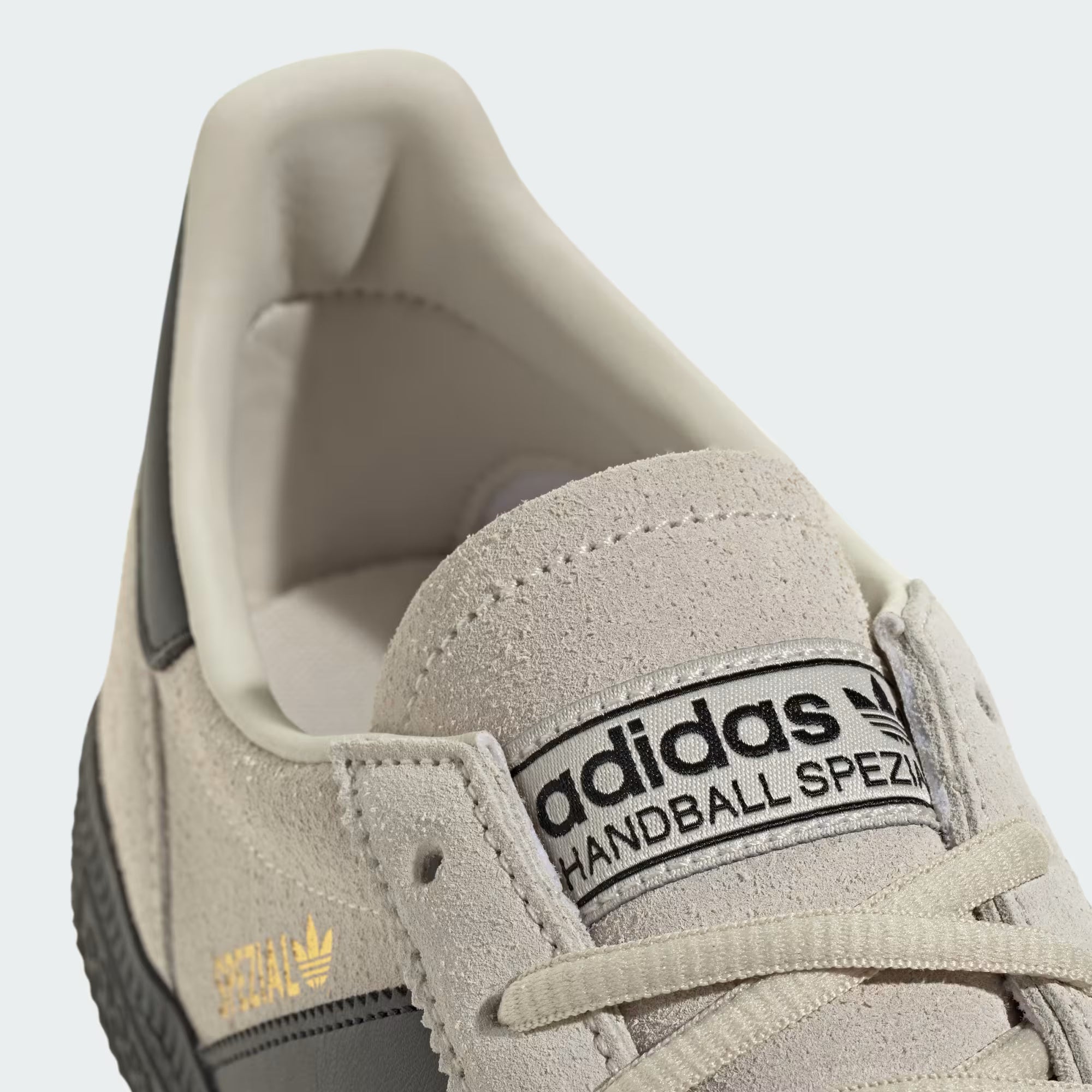 Side view of Handball Spezial Retro Sneakers showcasing grey suede and black leather details.