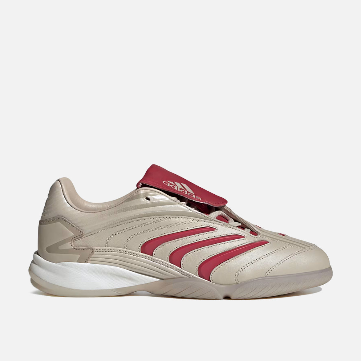 Adidas Predator Sala sneakers in beige and team victory red, highlighting the premium leather upper and rubber outsole.