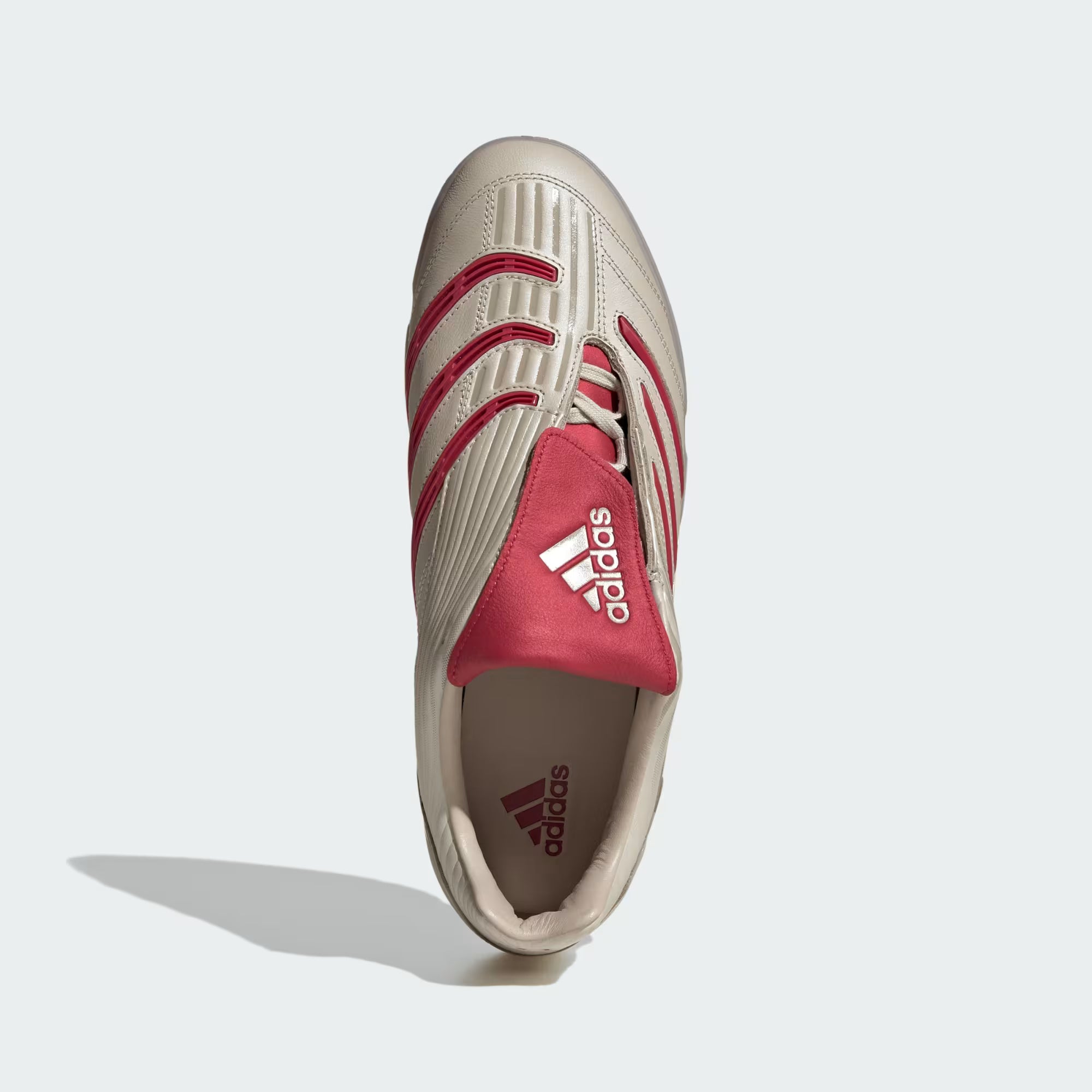 Adidas Predator Sala sneakers in beige and team victory red, highlighting the premium leather upper and rubber outsole.