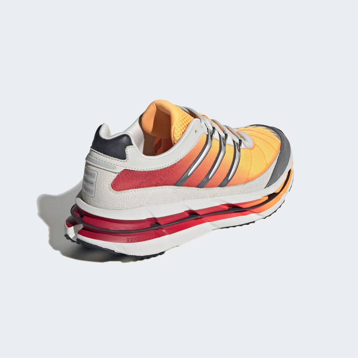 Close-up of the cushioned midsole and heel tab of Adidas Adistar HRMY shoes, emphasizing comfort and stylish design.