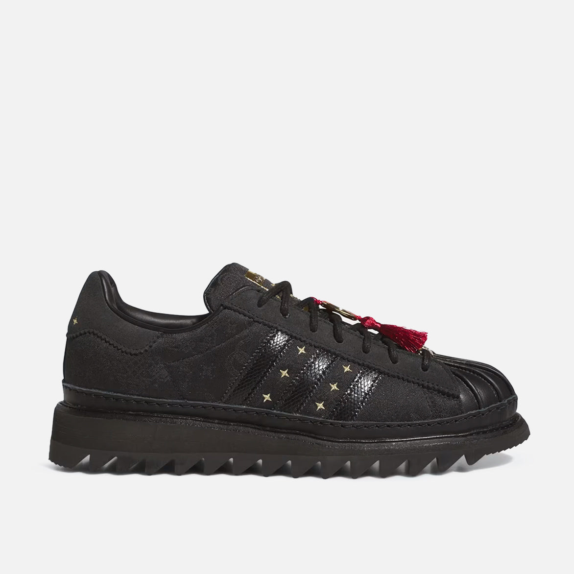 Close-up of CLOT x adidas Superstar Lunar New Year snakeskin 3-Stripes and gold star embroidery
