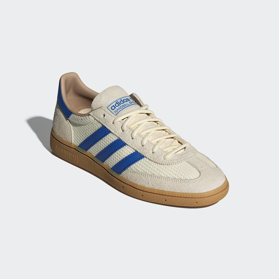 Side angle of vintage-style handball shoes showing suede overlays and branding