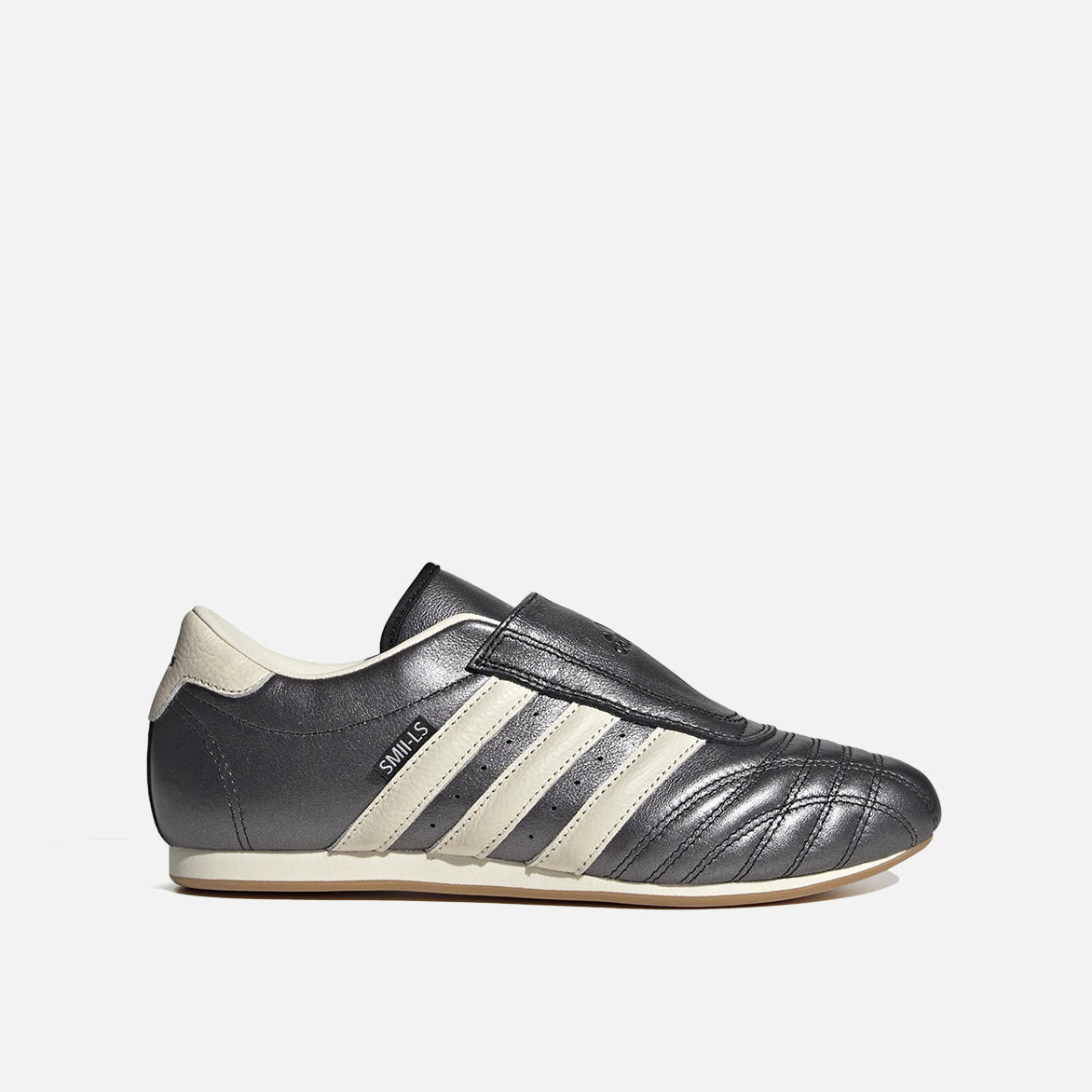 Close-up view of Women's Adidas Taekwondo Sneakers, highlighting the glossy black leather and metallic finish.