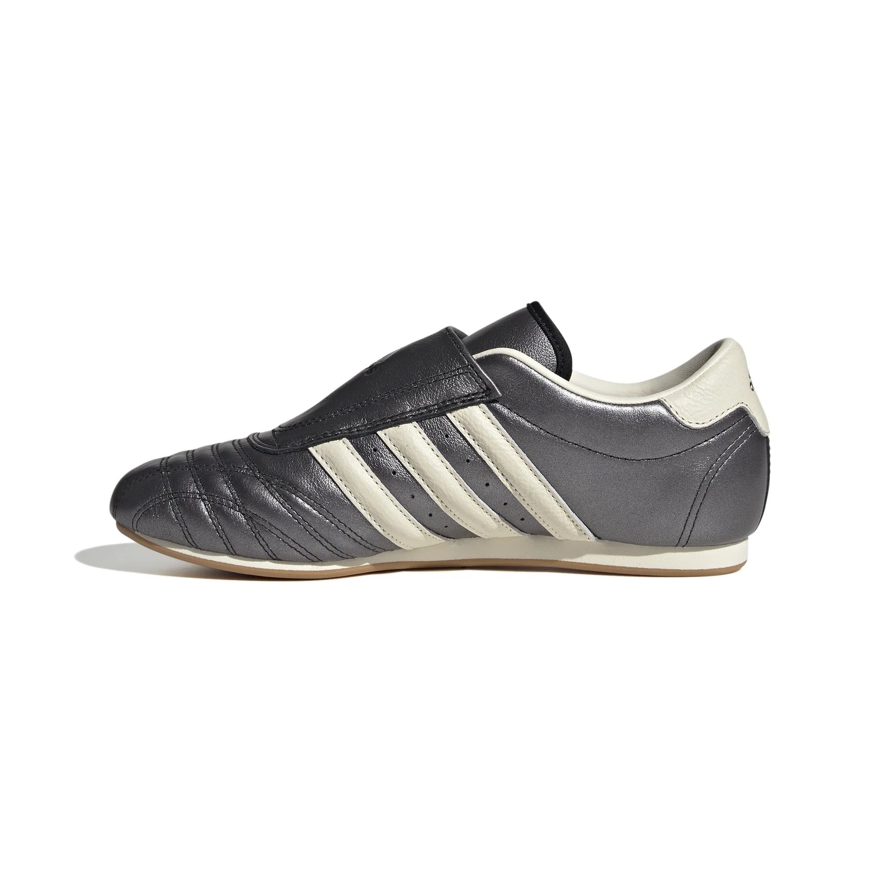 Lifestyle shot of Womens Adidas Taekwondo Sneakers worn in a casual setting, perfect for streetwear style.