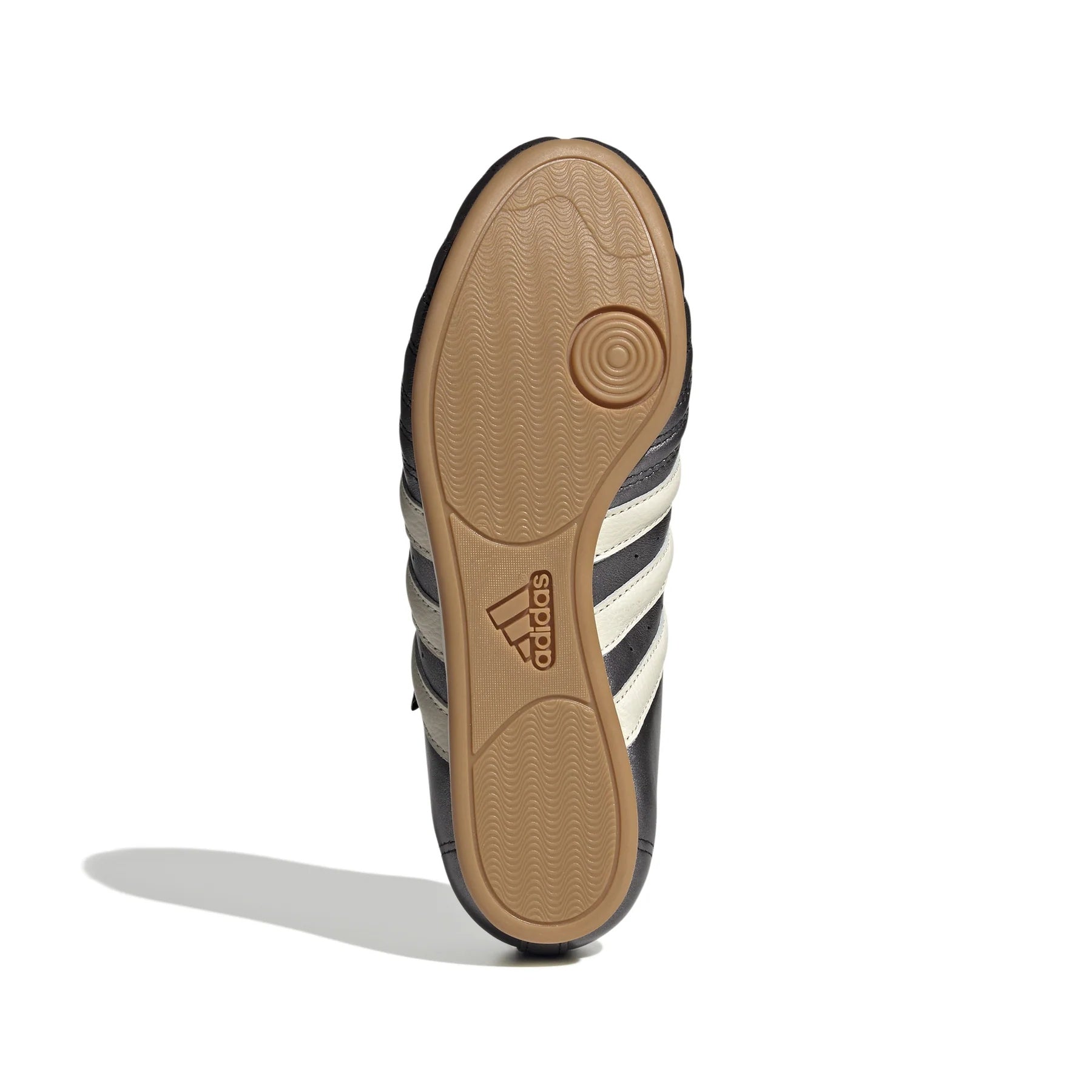 Side angle of Adidas Taekwondo shoes, emphasizing the low-profile gum rubber sole for optimal performance.