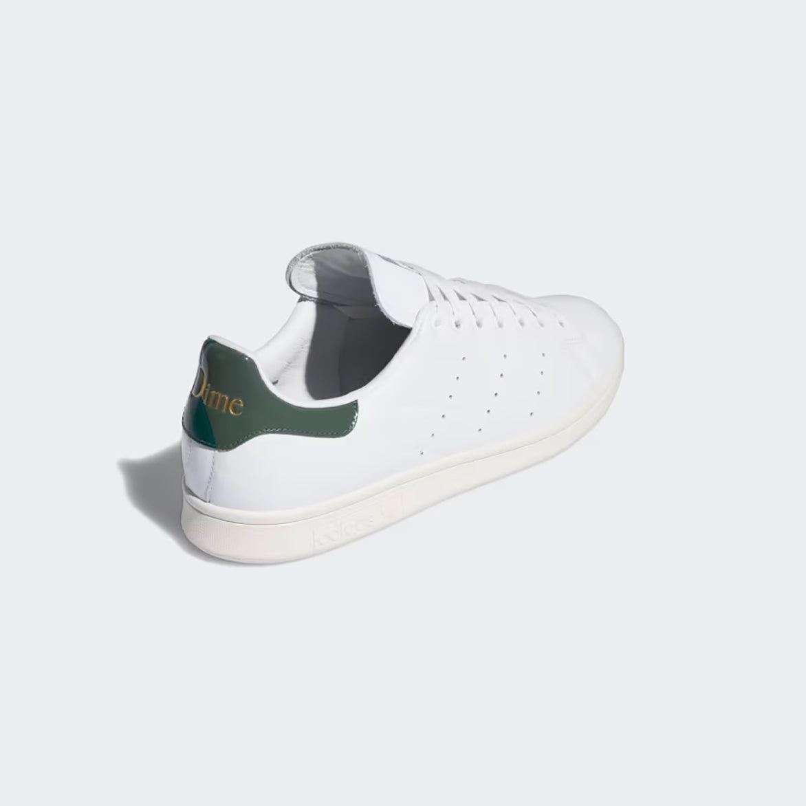 Front view of the DIME x Adidas Stan Smith shoes highlighting the custom tongue art