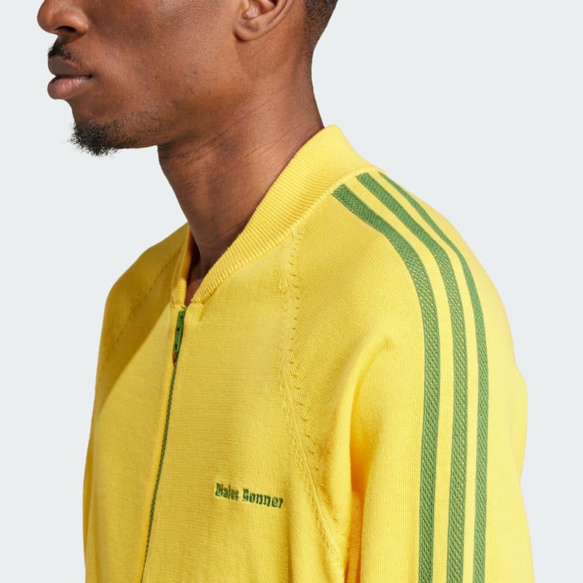 Model wearing the limited edition Wales Bonner adidas jacket outdoors, showcasing its stylish fit