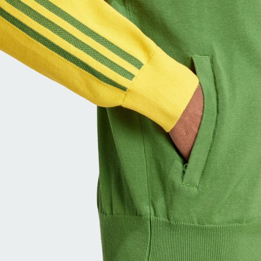 Wales Bonner x adidas nylon track jacket front view with bold gold and crew green colors