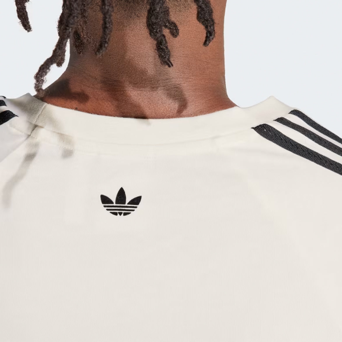 Front view of white limited edition athletic t-shirt with black stripe details