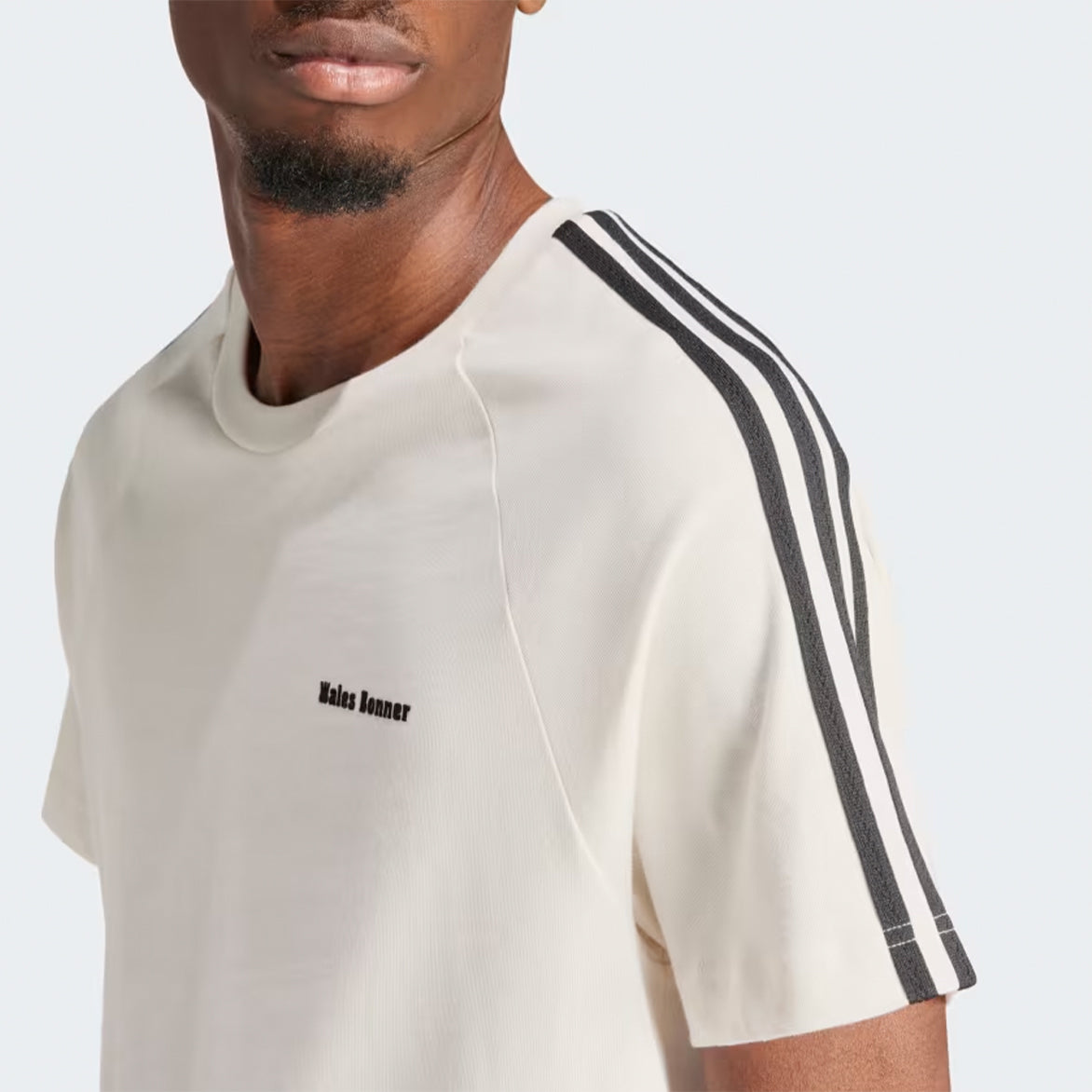 Model wearing organic cotton soccer jersey tee for casual and athletic wear