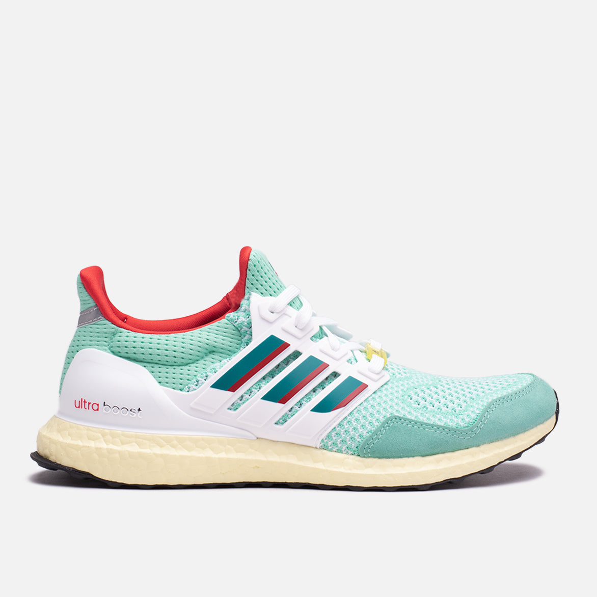 Side view of the Adidas Ultraboost 1.0 DNA ZX 9000 showcasing its mint green color and sleek design.