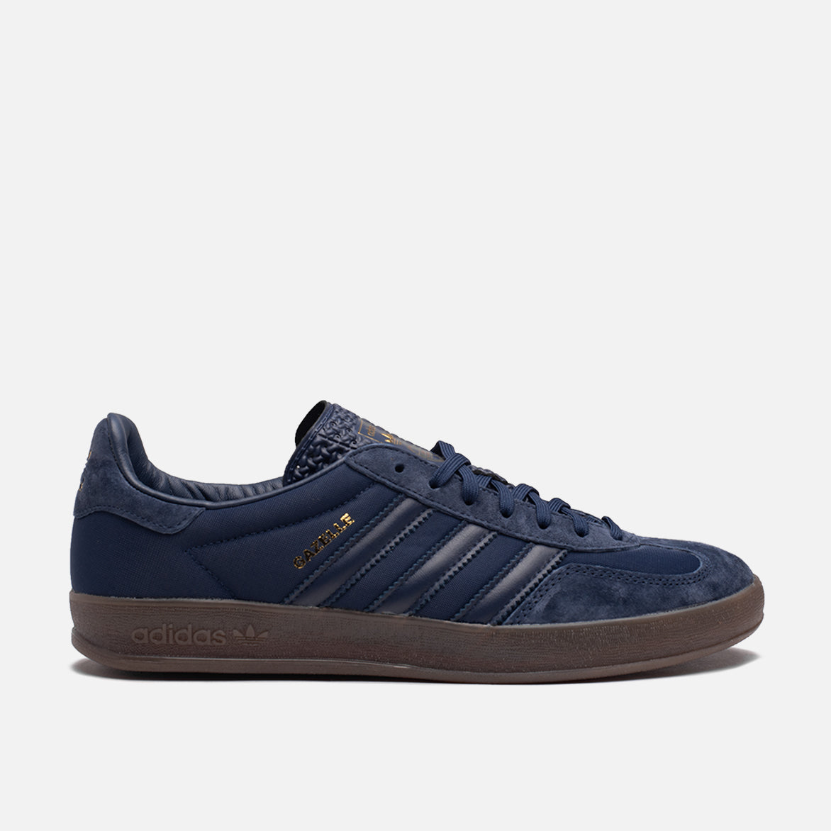 Adidas Gazelle indoor sneakers in college navy with side view highlighting the Three Stripes
