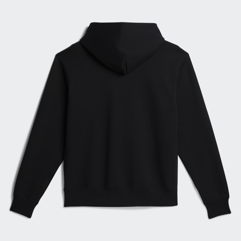 Side angle of the hoodie highlighting the Human Race sleeve detail and ribbed cuffs