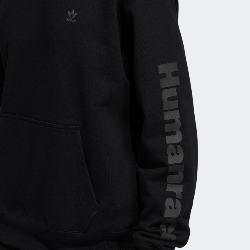 Lifestyle shot of the hoodie worn casually, showcasing its gender-neutral fit and streetwear appeal