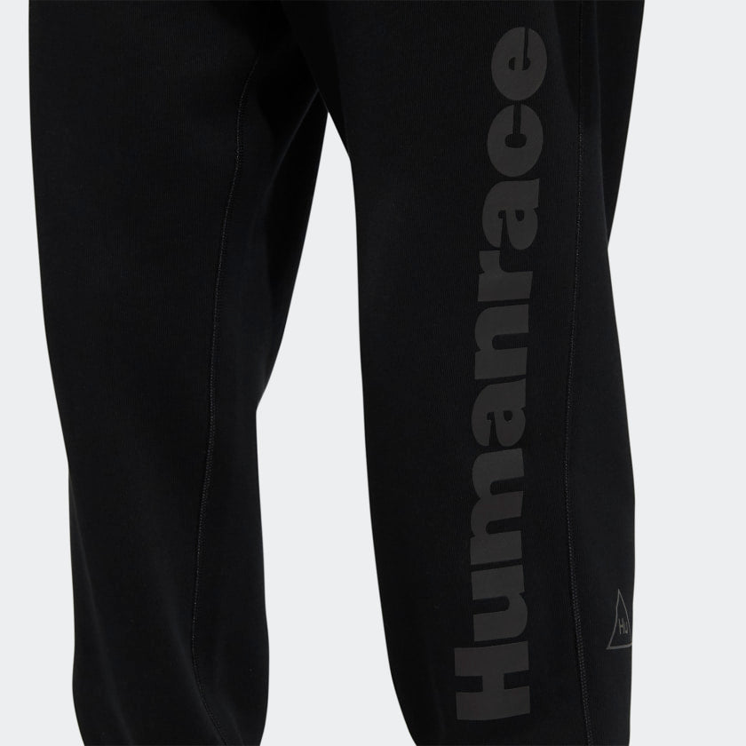 Back view of Pharrell x Adidas black joggers featuring the back pocket design and overall style.